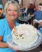 Deb and her Happy Birthday cake photo by Deanna Bridell
